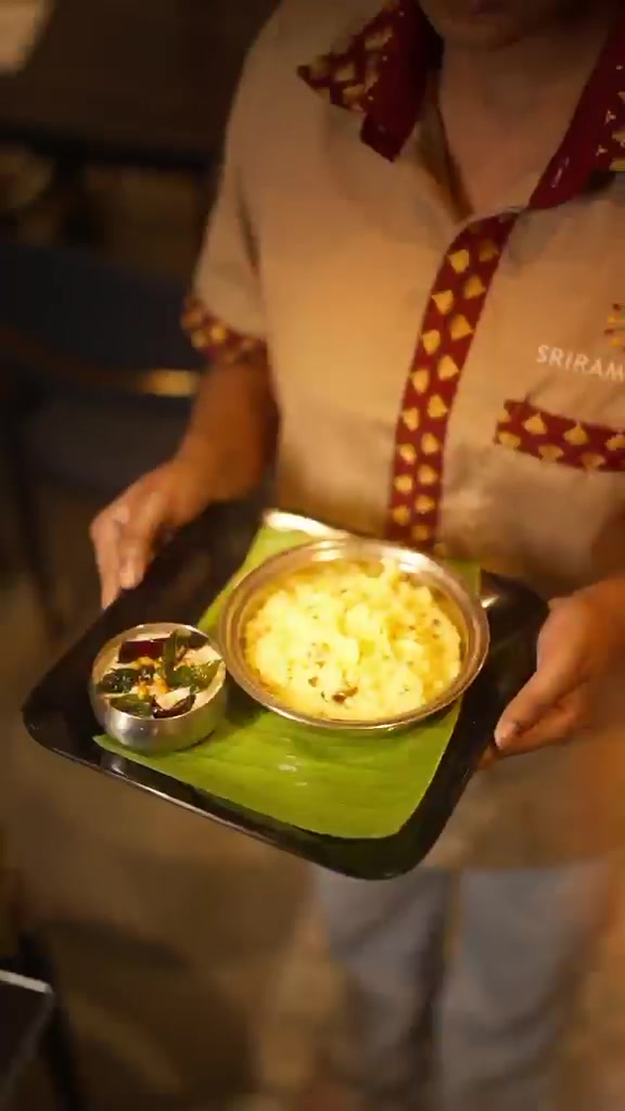 Staff carrying a lunch tray at Sri Ram Cafe, Koramangala 5th Block